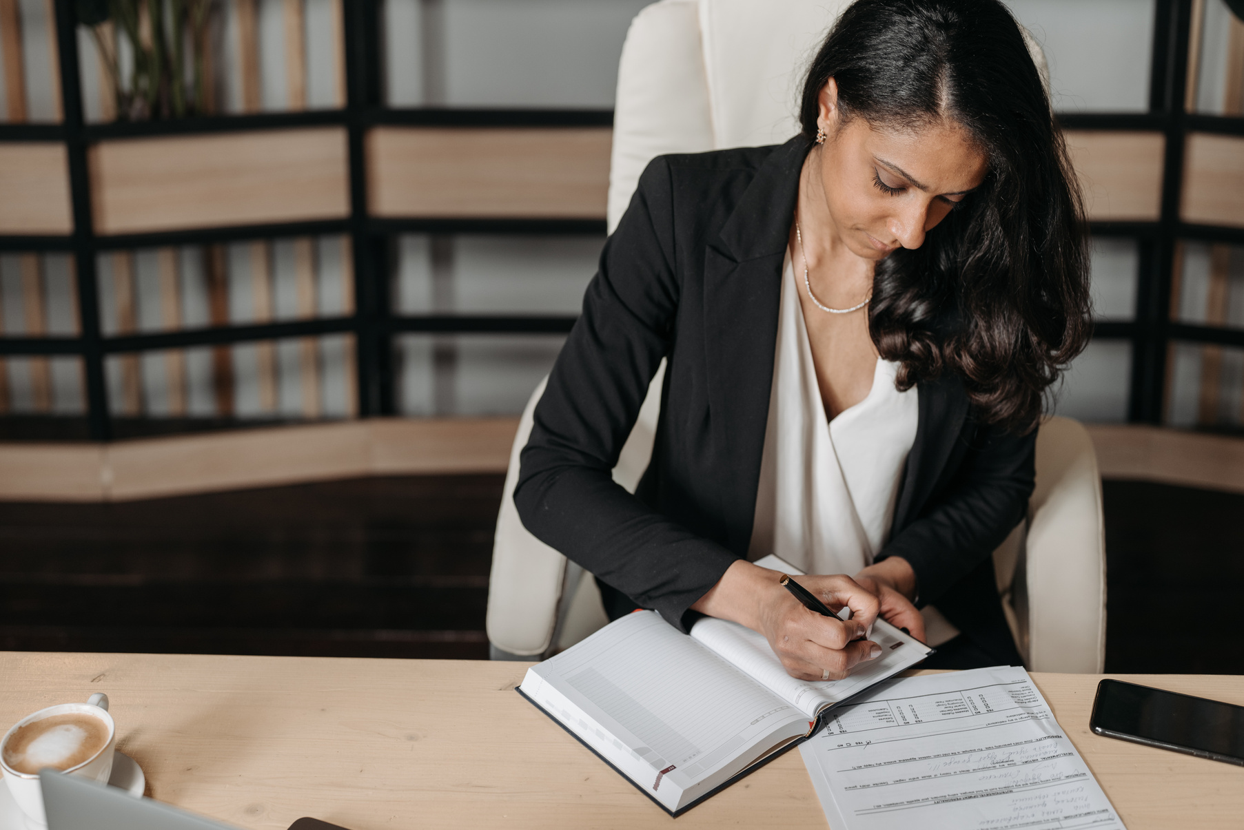 Woman in Black Blazer Using Macbook