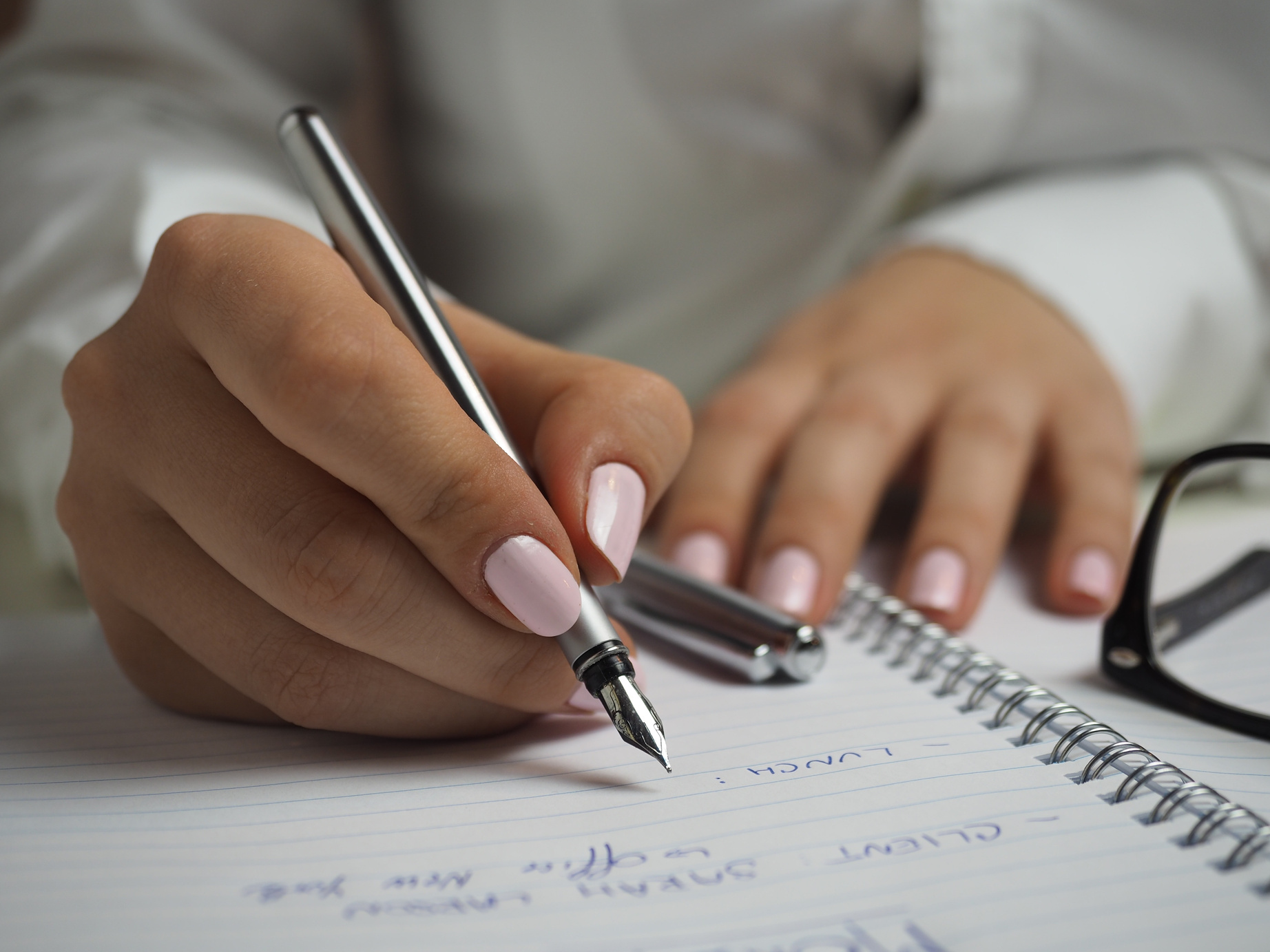 Woman Writing Down Notes