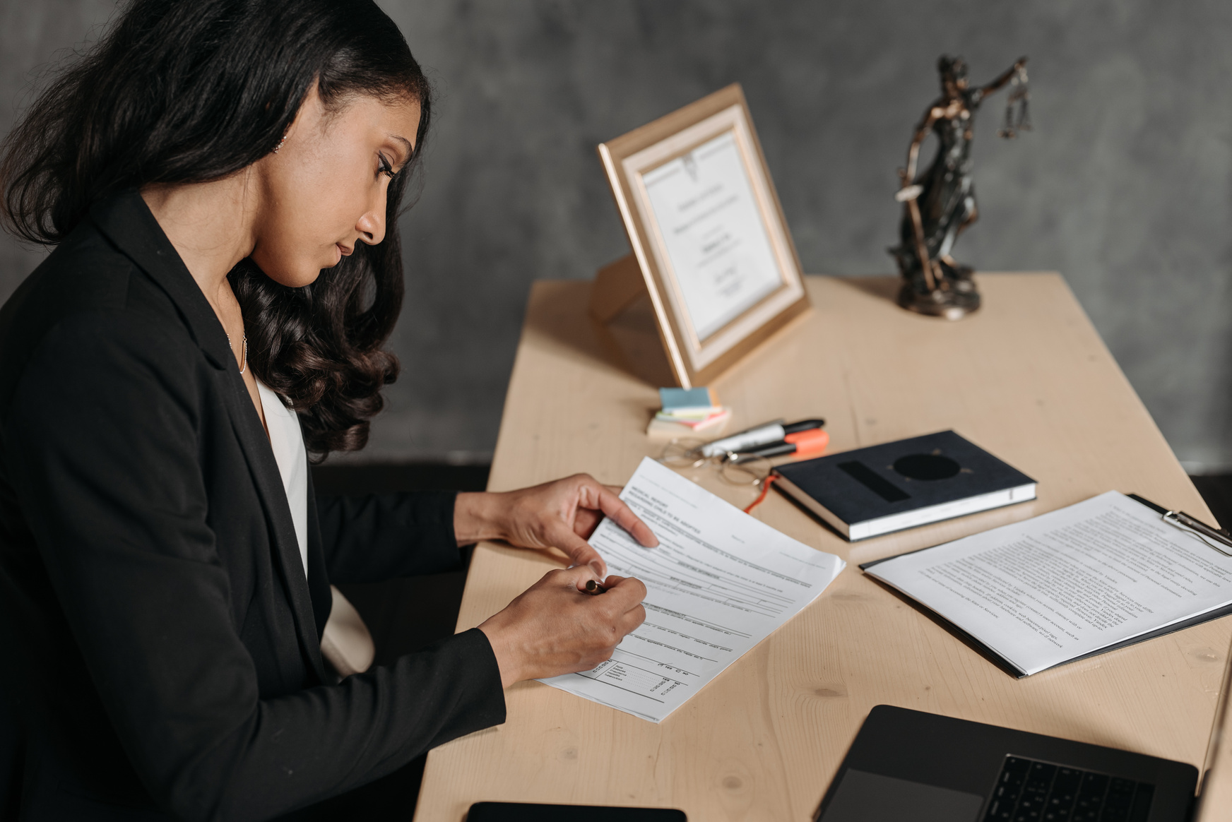 Female Lawyer looking at Documents